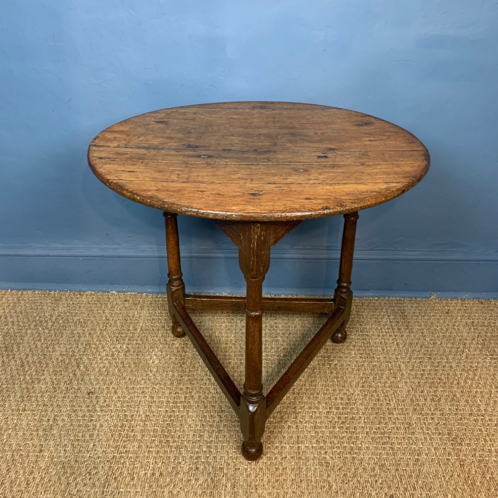 A late 18th century oak cricket table 