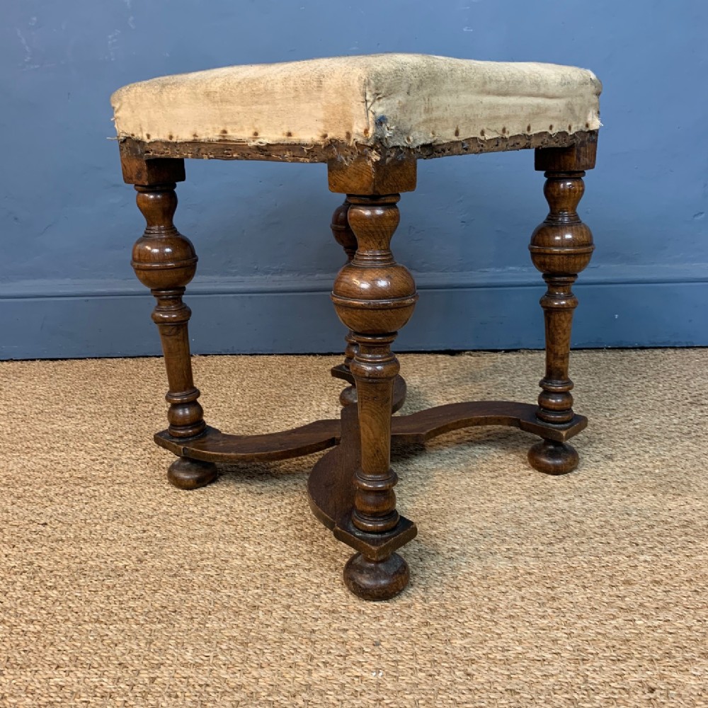 A William and Mary style walnut x-frame stool circa 1900.