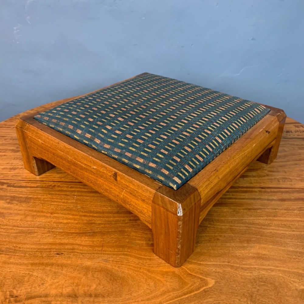 An early Gordon Russell walnut footstool circa 1927