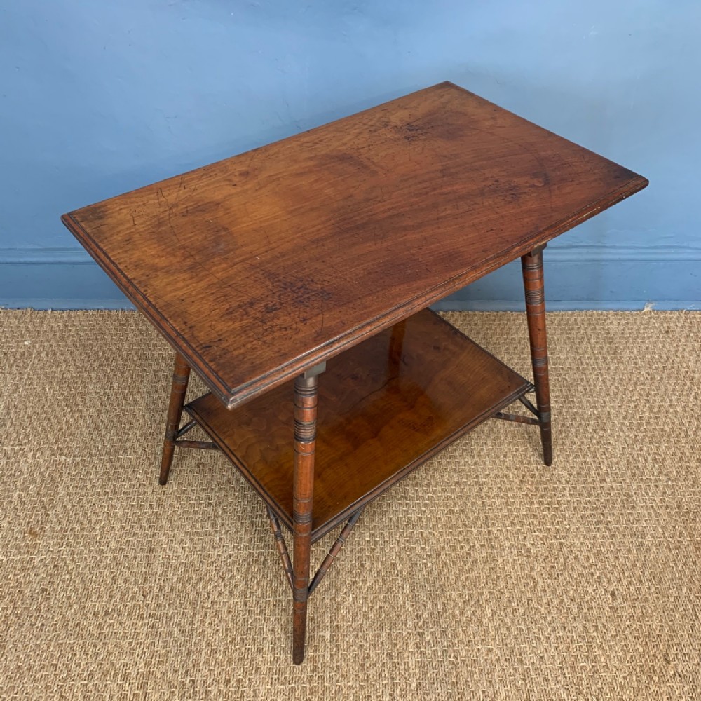 An Aesthetic Movement walnut rectangular two tier table circa 1880