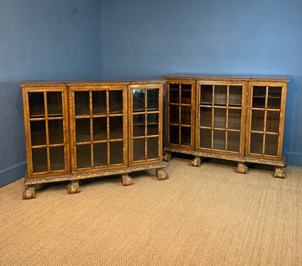A fine pair of George 1 style walnut and parcel gilt breakfront side cabinets
