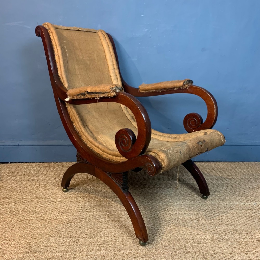 A George 1V mahogany scrolled library armchair circa 1830 after a design by JC Loudon