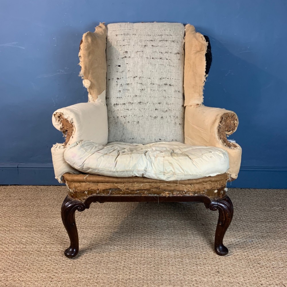 A late 19th century George 11 style mahogany wing armchair c 1890