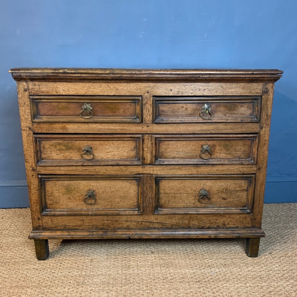 A William and Mary solid walnut chest of drawers circa 1700