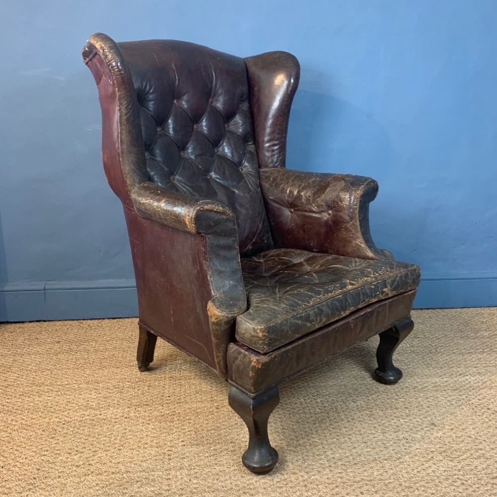 A late Victorian leather wing armchair c 1890 