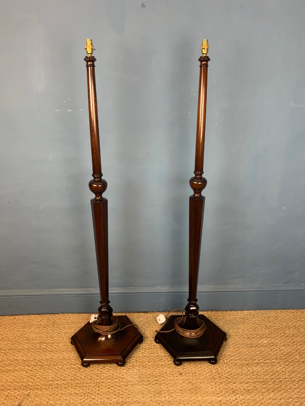 A pair of Heals style mahogany standard lamps circa 1920