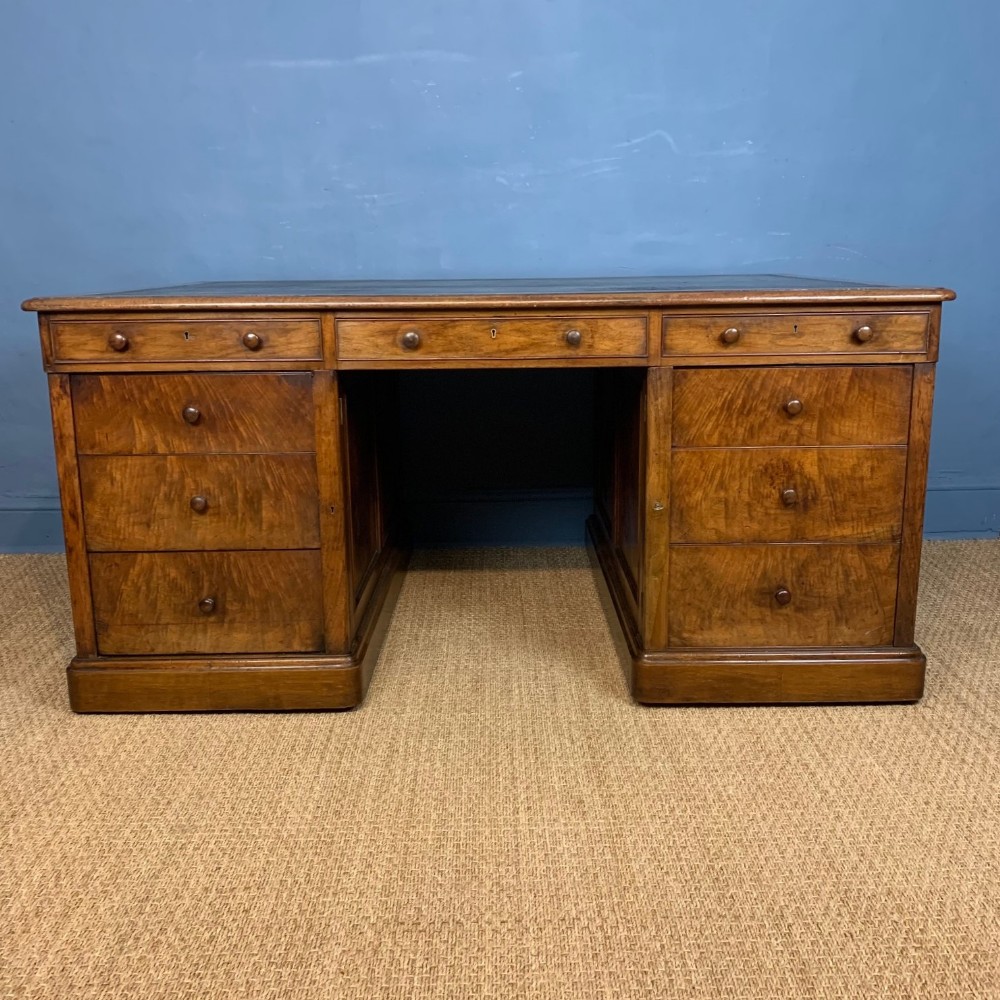 A fine early Victorian walnut partners desk circa 1840