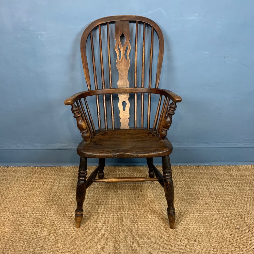A 19th c high back elm Windsor Chair