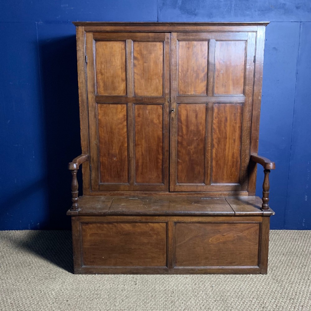 A late Georgian oak and apple bacon settle circa 1830