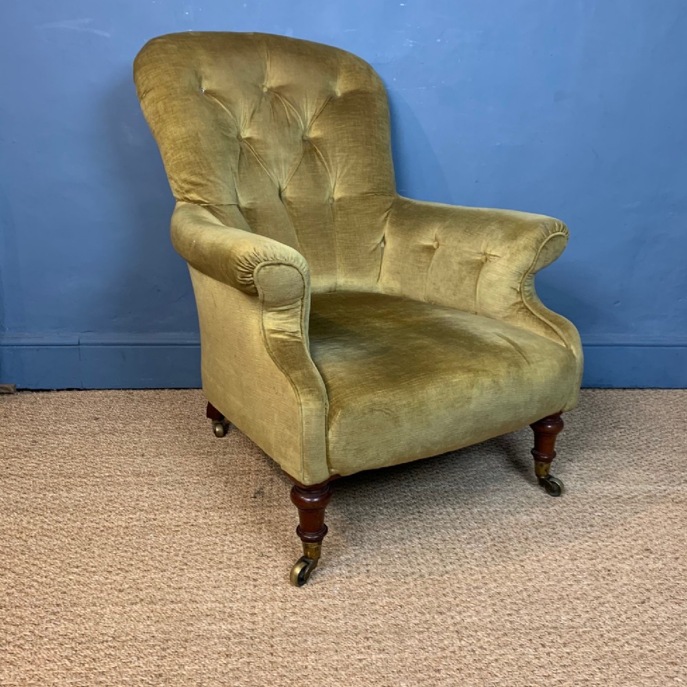 A large Victorian spoon backed armchair circa 1850