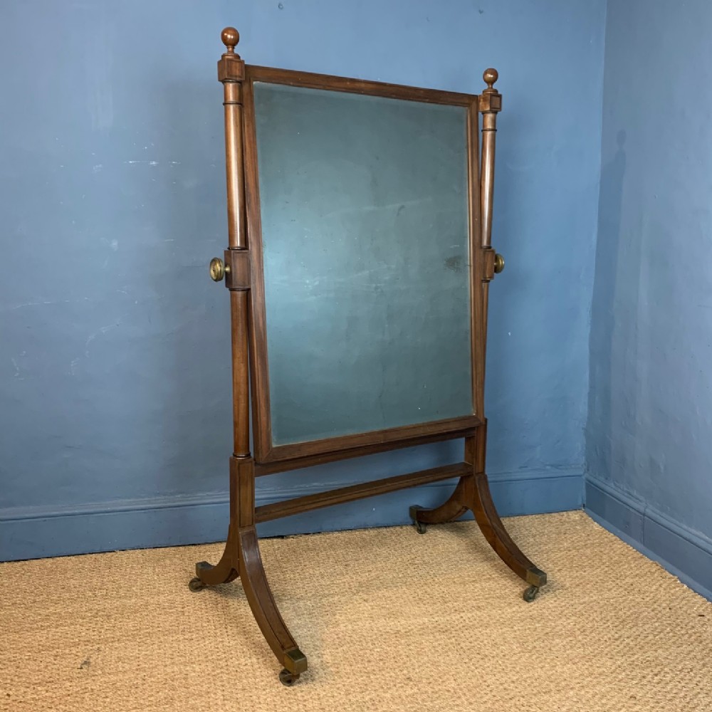 A Regency mahogany and ebony strung cheval mirror circa 1815