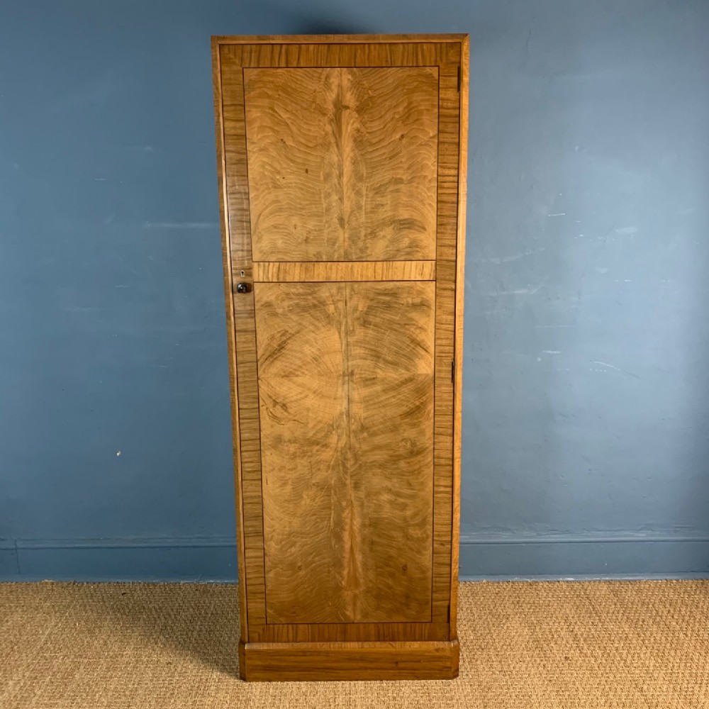 A Heals walnut single door wardrobe circa 1930