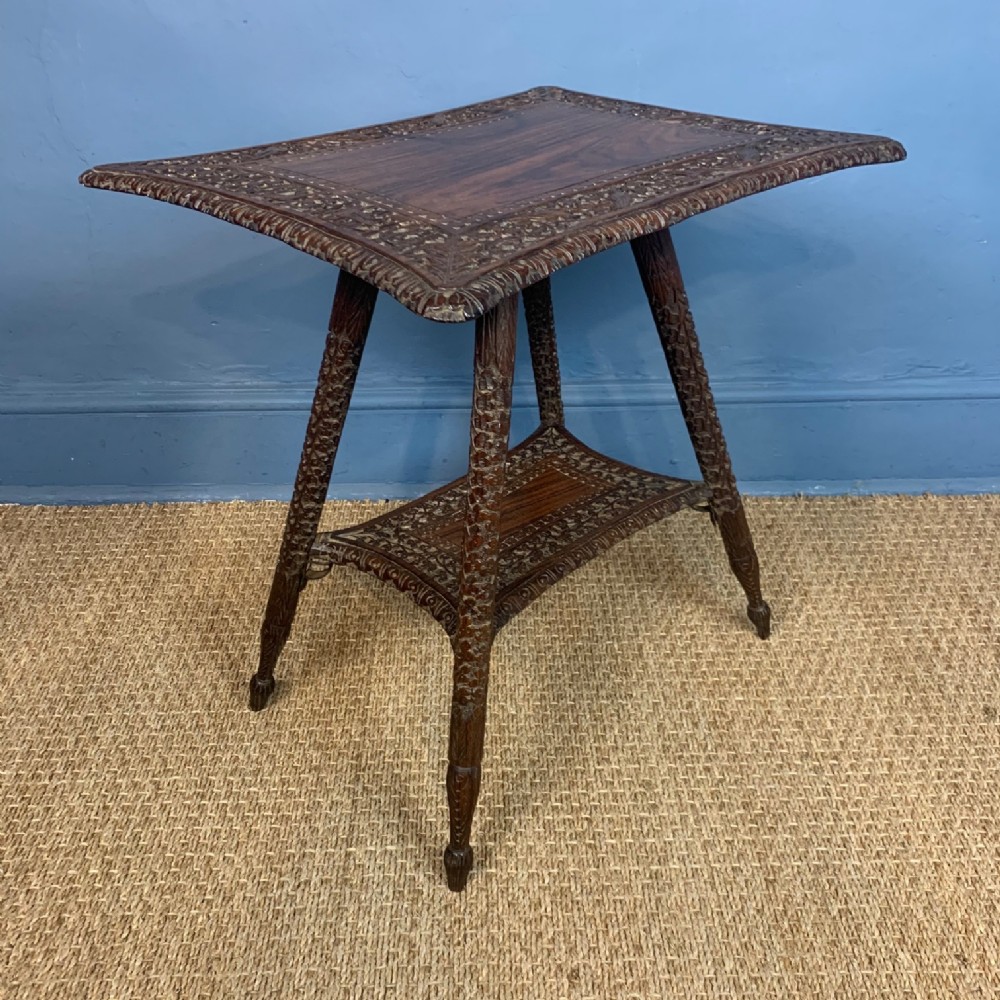 An Anglo Indian carved teak 2 tier occasional table . Bombay Presidency circa 1890