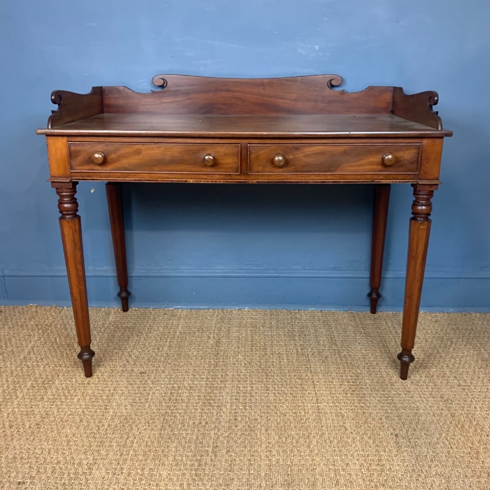 A William IV mahogany dressing or writing table circa 1830