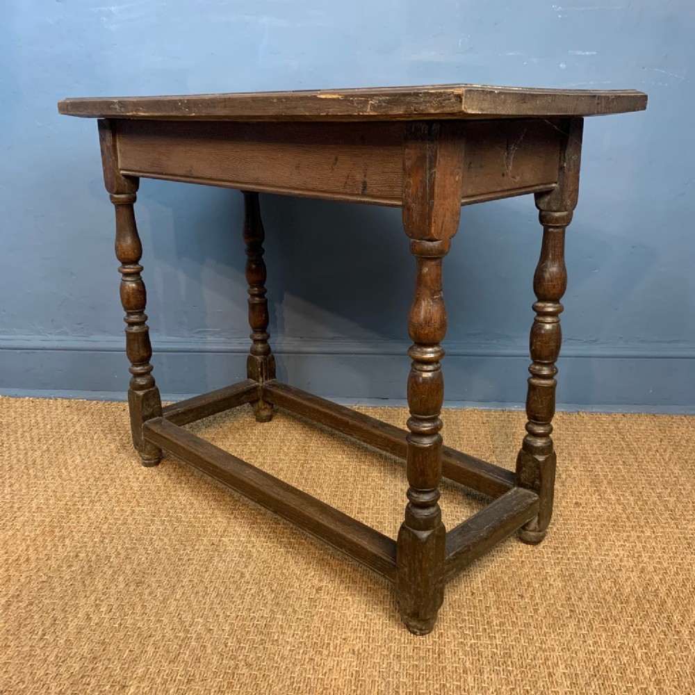  A late 17th oak side table circa 1680 of narrow proportions