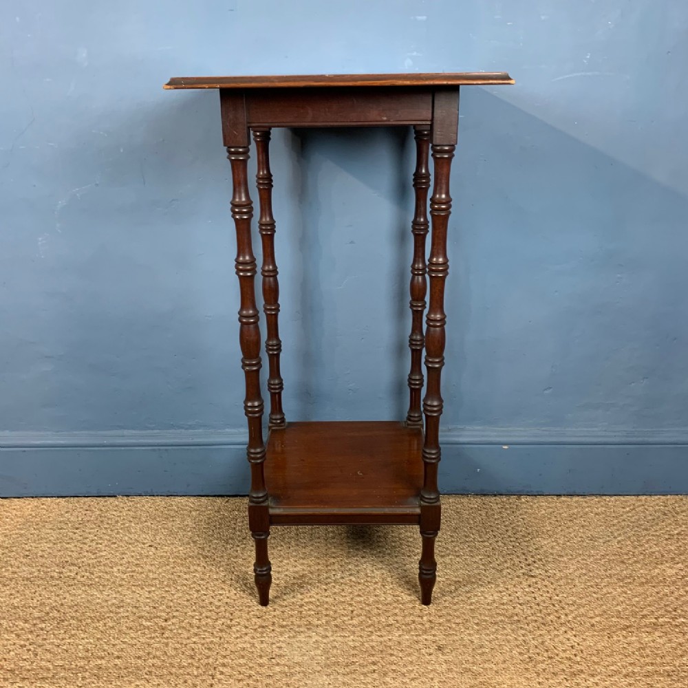 An unusual Aesthetic Movement 2 tier mahogany high table in the style of EW Godwin circa 1890.