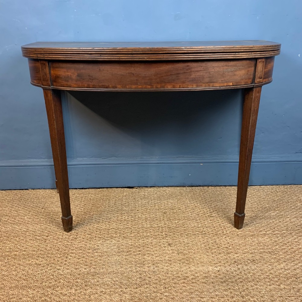A George 111 mahogany D shaped tea table circa 1810