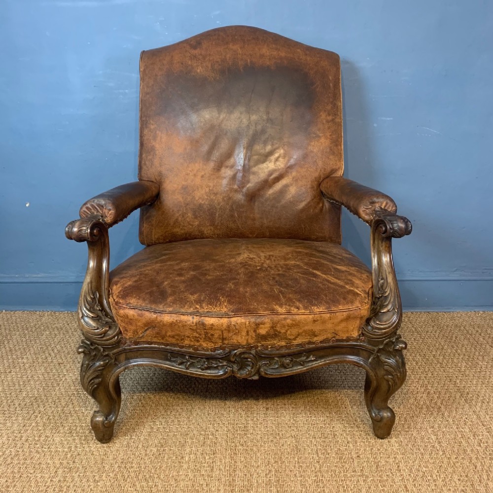 An enormous Victorian mahogany and leather library armchair circa 1870