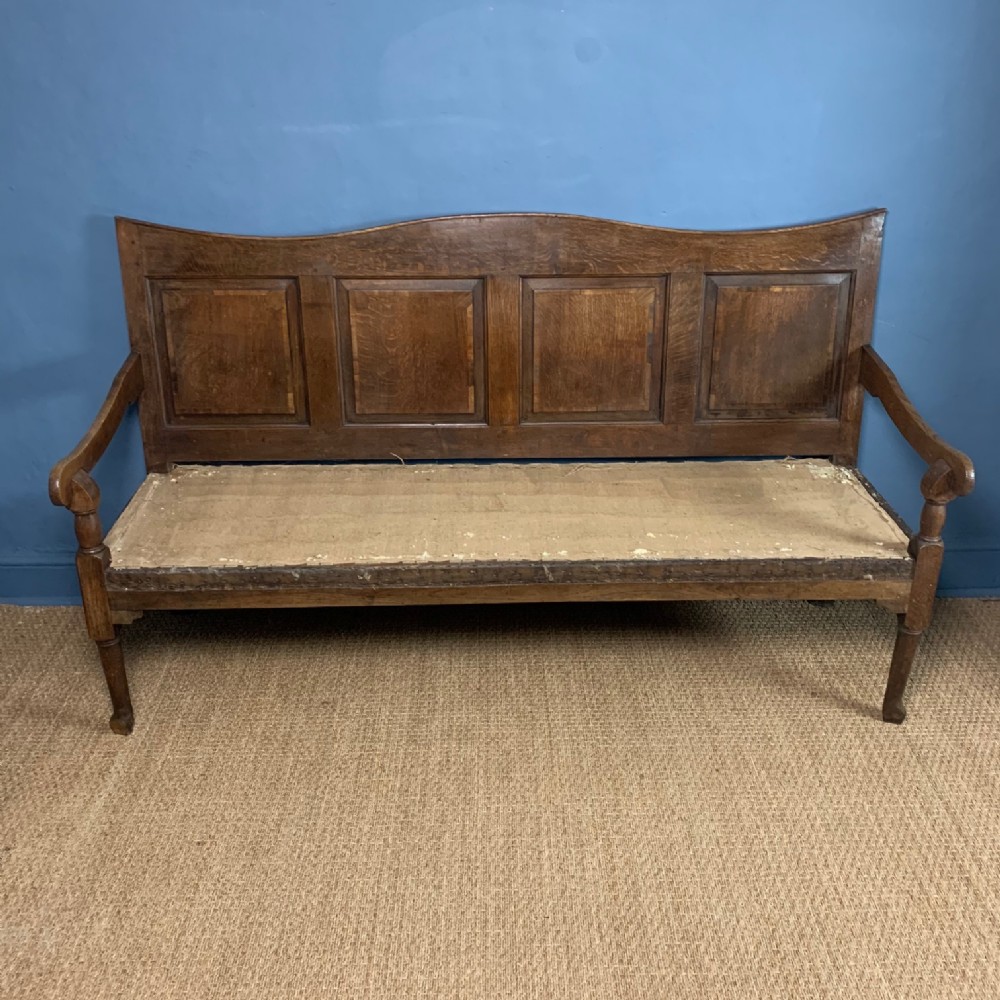 An 18th c Yorkshire oak panel back settle