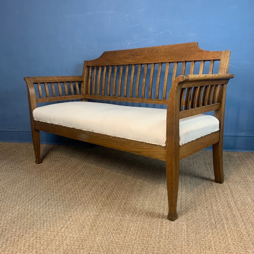 An Arts and Crafts oak sofa circa 1910 