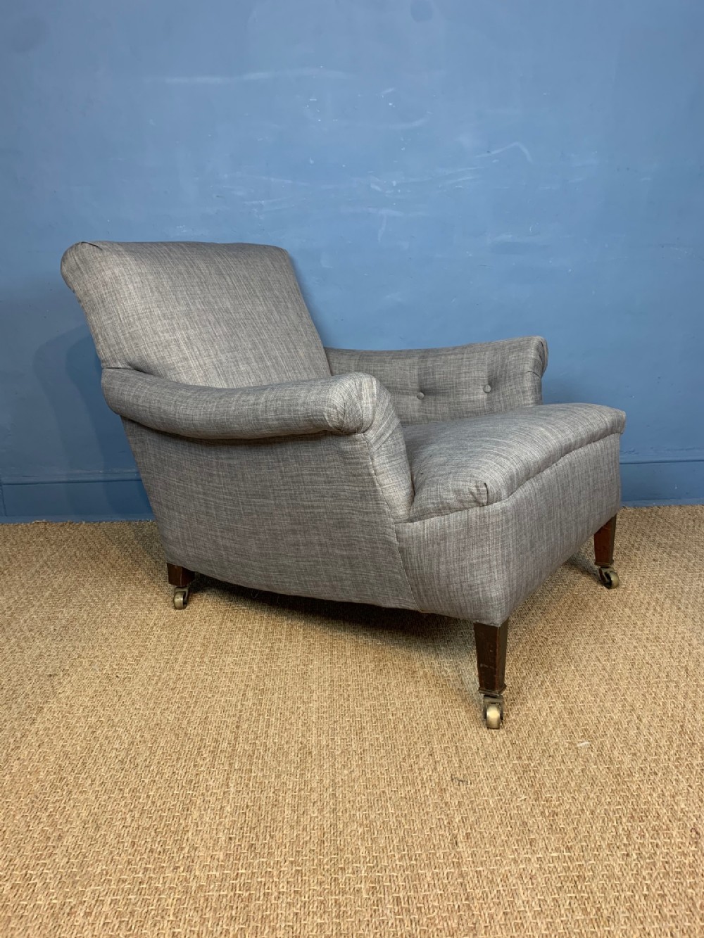 A large Edwardian country house armchair in the Howard style circa 1910