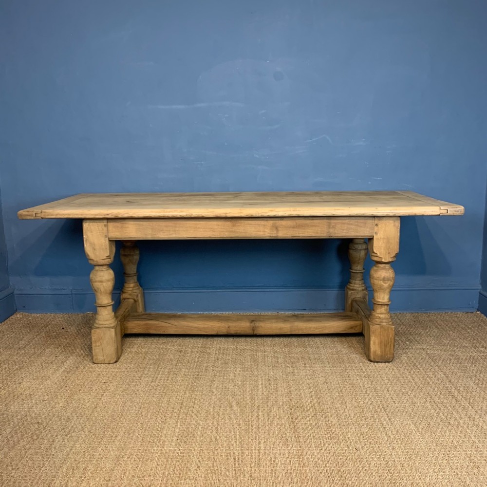 An Arts and Crafts bleached oak refectory table circa 1910