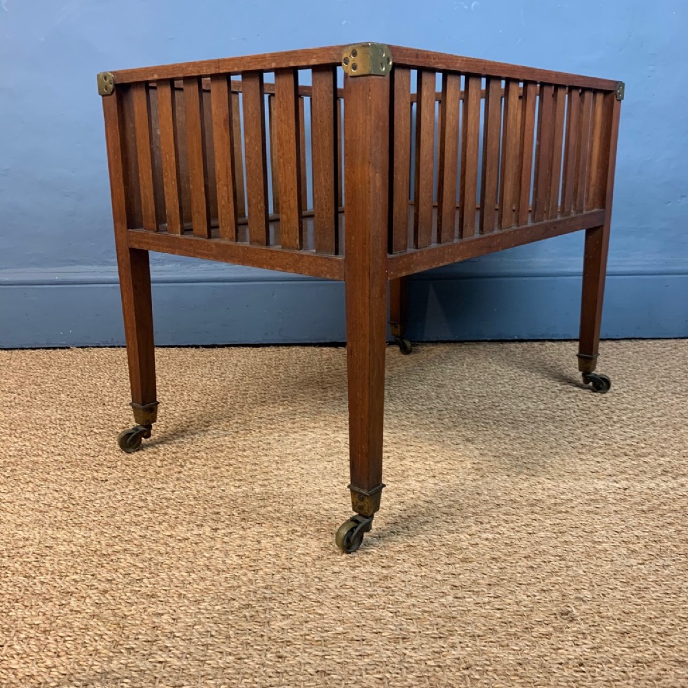 A late 19th century teak Canterbury or magazine rack circa 1900