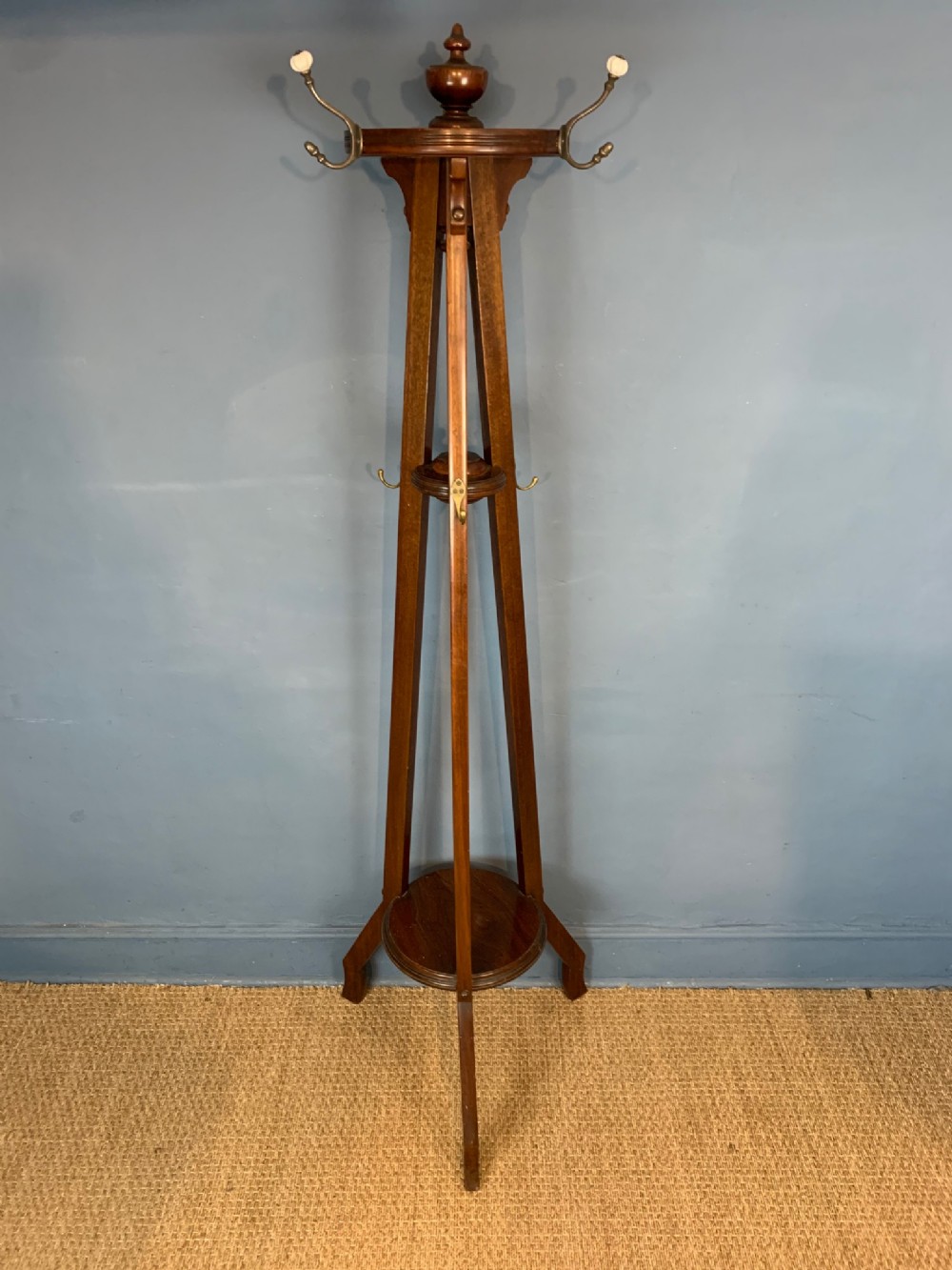 An Edwardian mahogany tripod coat and hat stand circa 1910