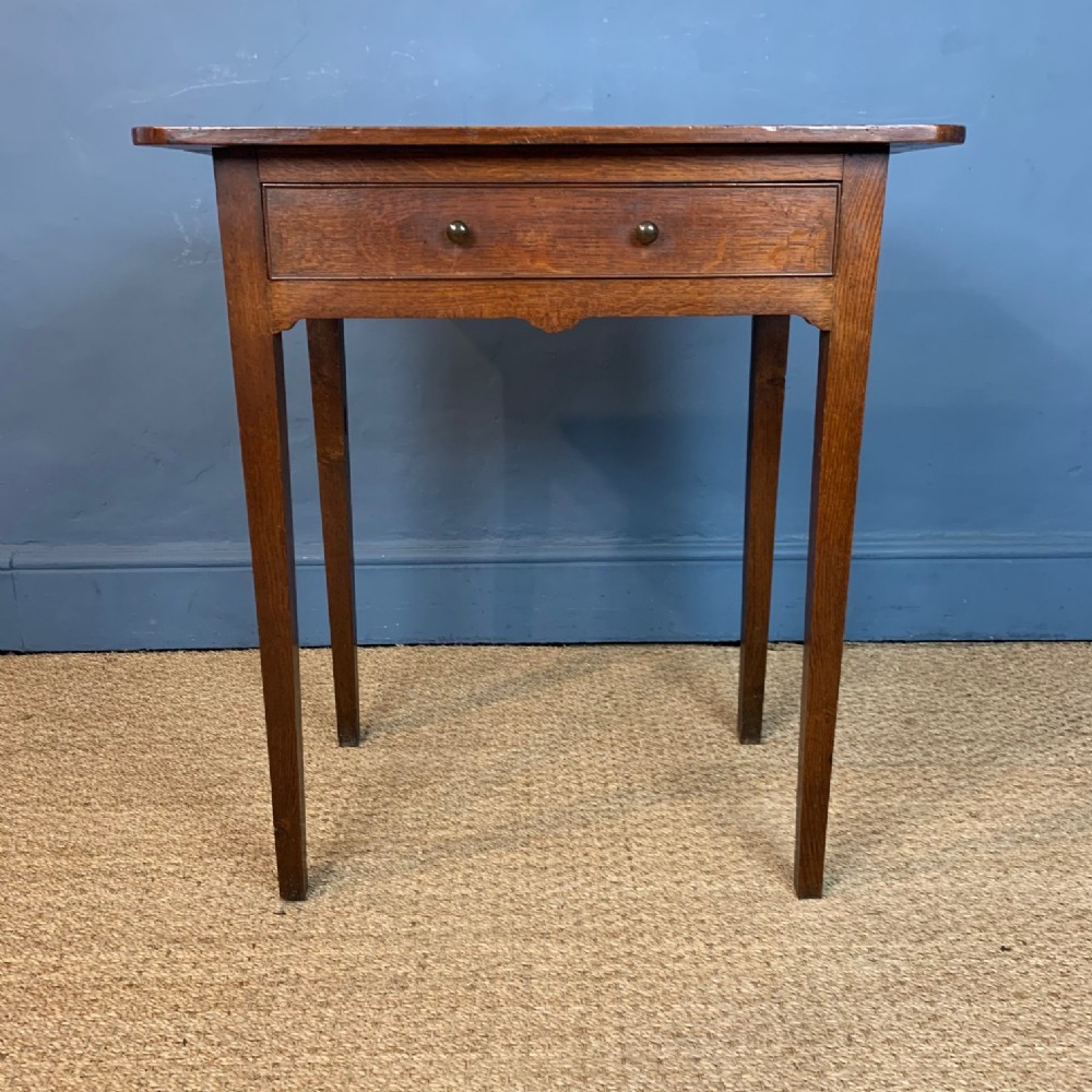 A small George 111 oak provincial side table circa 1810