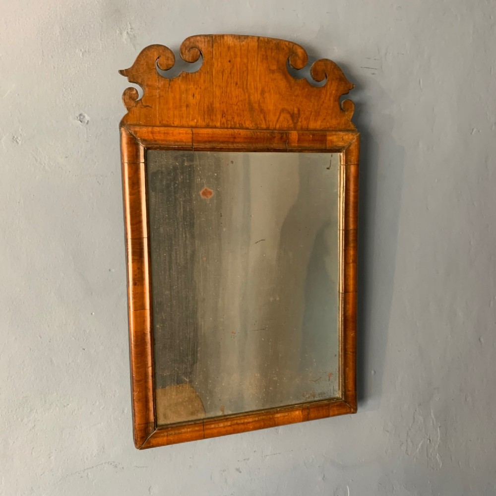 A small George 11 walnut wall mirror circa 1740