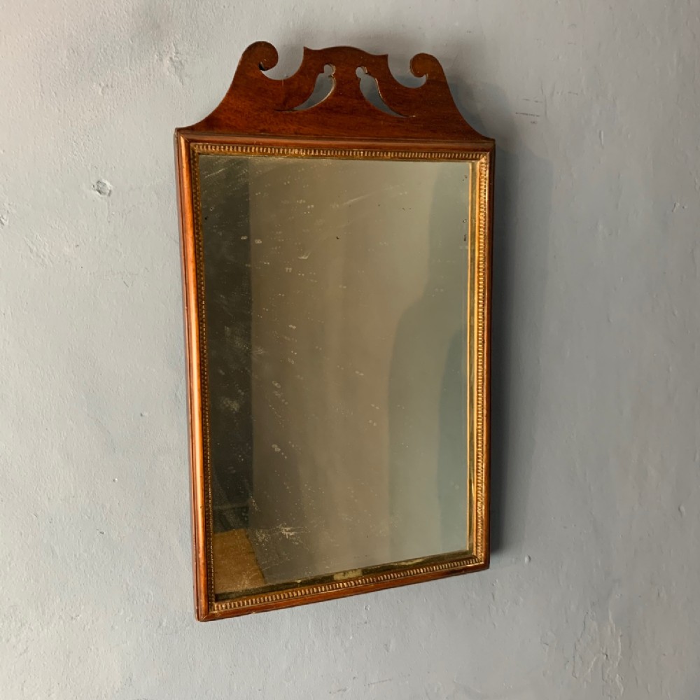 An early George 111 mahogany and parcel gilt rectangular wall mirror circa 1770