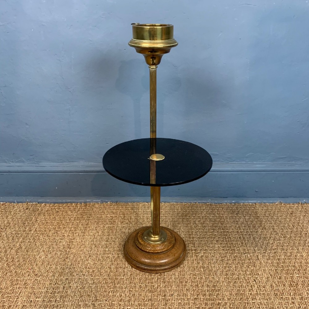 An unusual Edwardian brass and oak cigarette tray and drinks stand c 1910