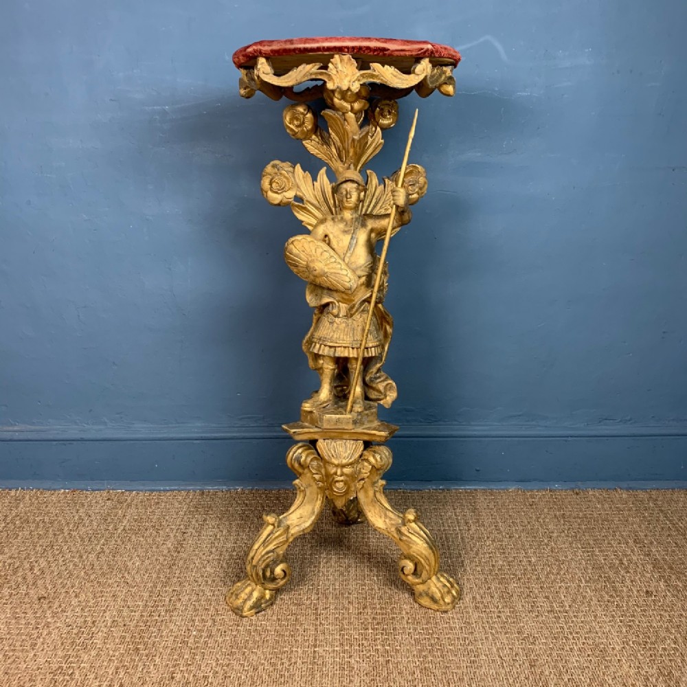 A rare English Medievalist Revival giltwood torchere stand circa 1840