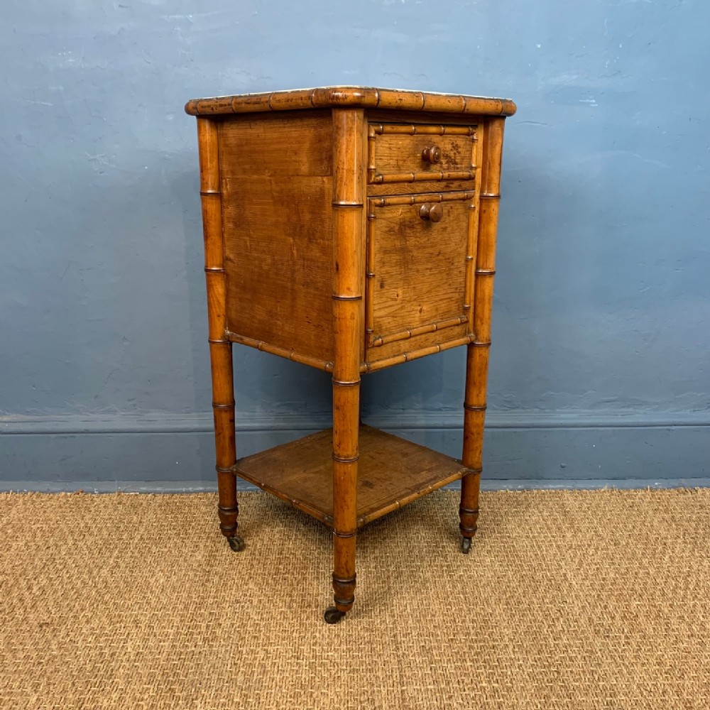 A late 19th c French faux bamboo maple bedside table circa 1880