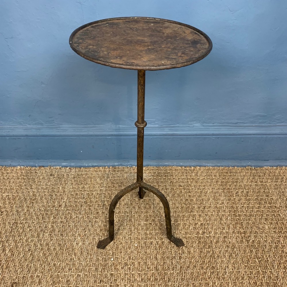 A late 19th c Iberian wrought iron and gilt tripod table.