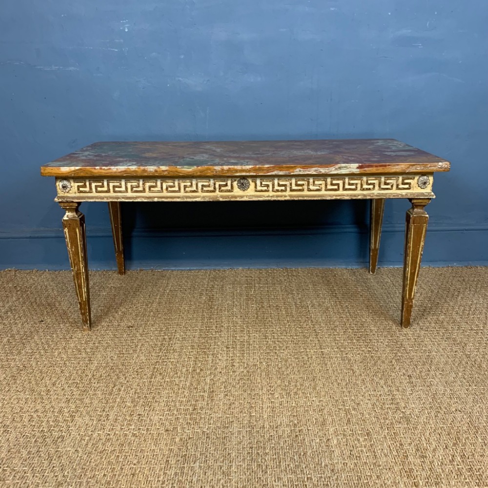 A 1920's painted and parcel gilt coffee table in classical style