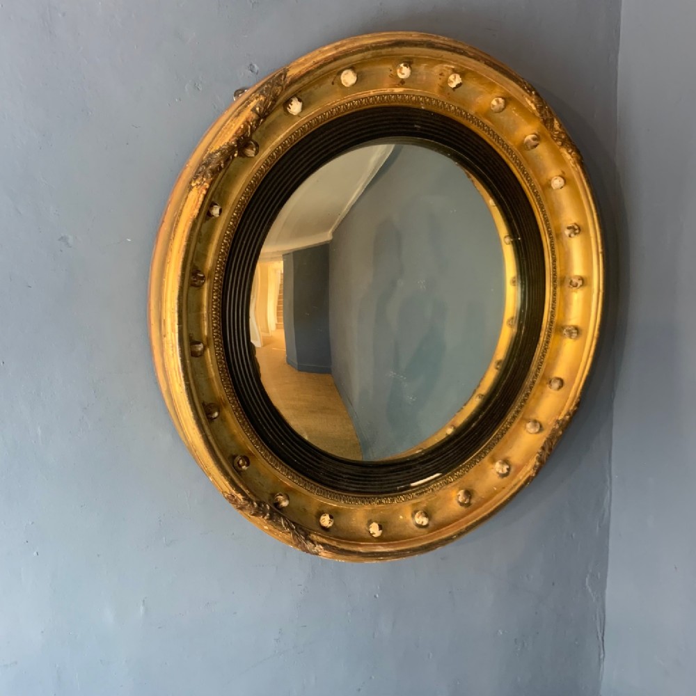 A large George IV gilt convex mirror circa 1830