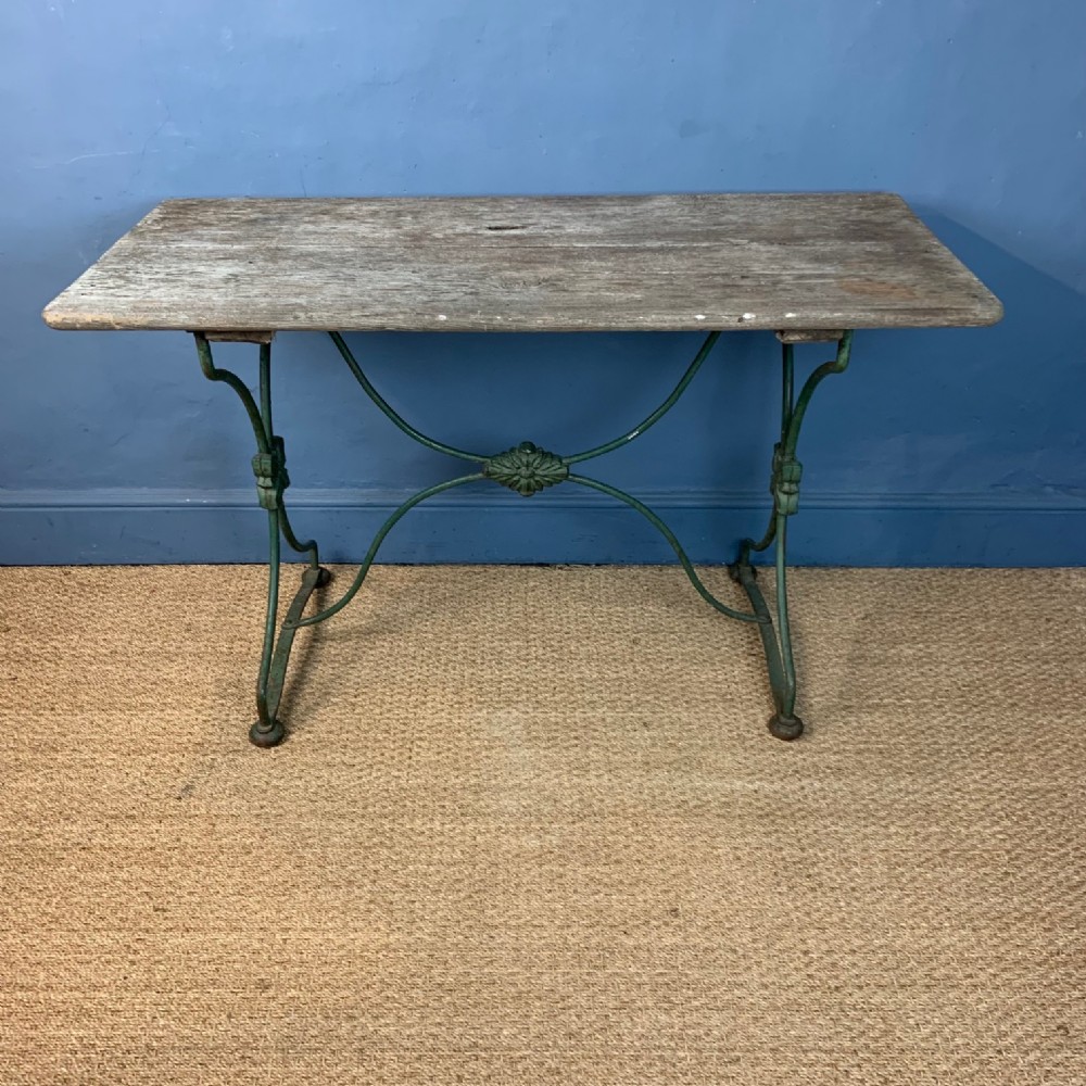 A Victorian oak and painted iron garden table circa 1870