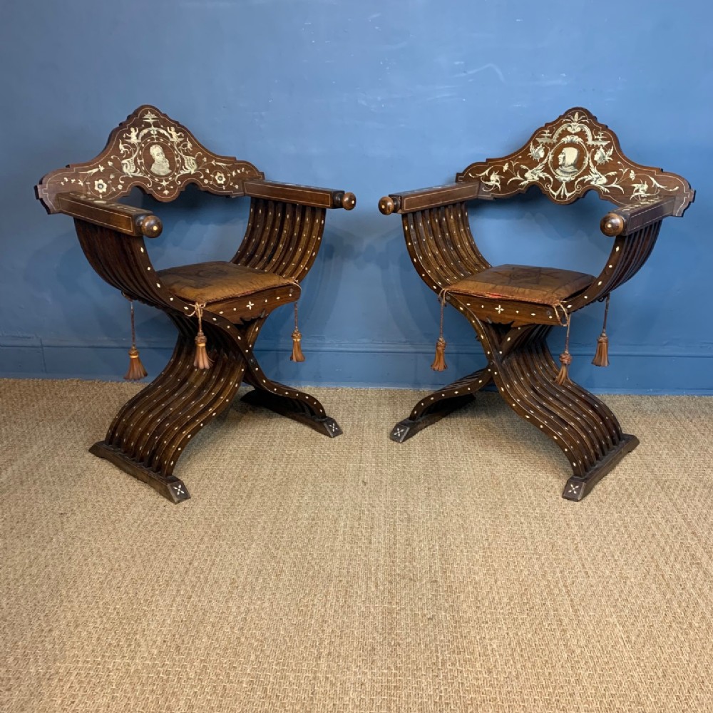 A pair of Milanese walnut and bone inlaid Savonarola chairs circa 1870 