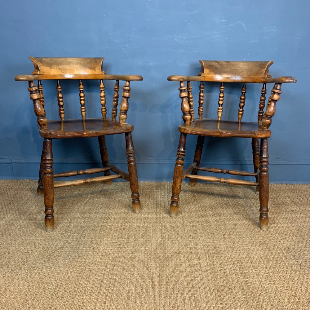 A pair of late 19th Century birch and elm smokers bow chairs circa 1890