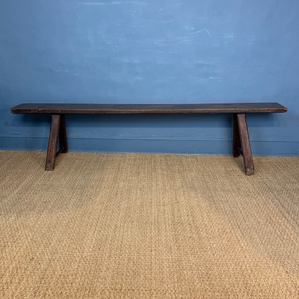 A 19th Century West-Country elm long bench.