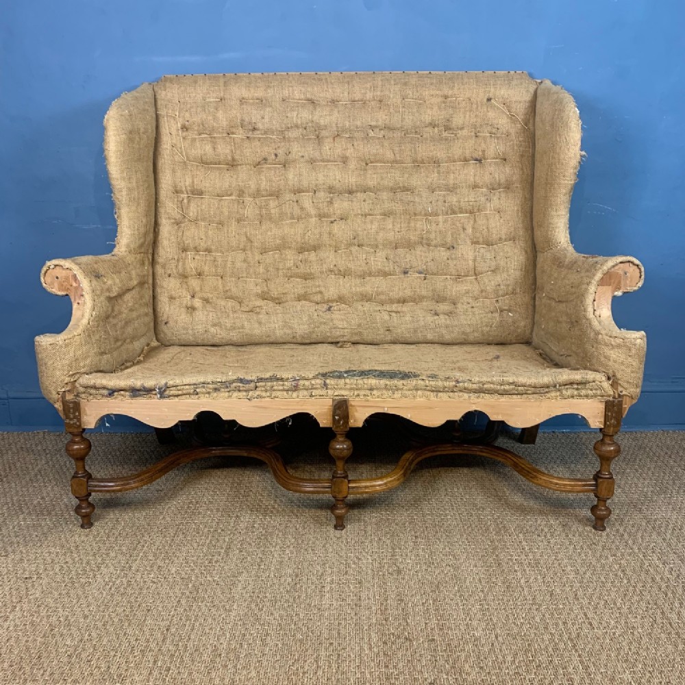 A William and Mary style walnut high-back sofa circa 1900