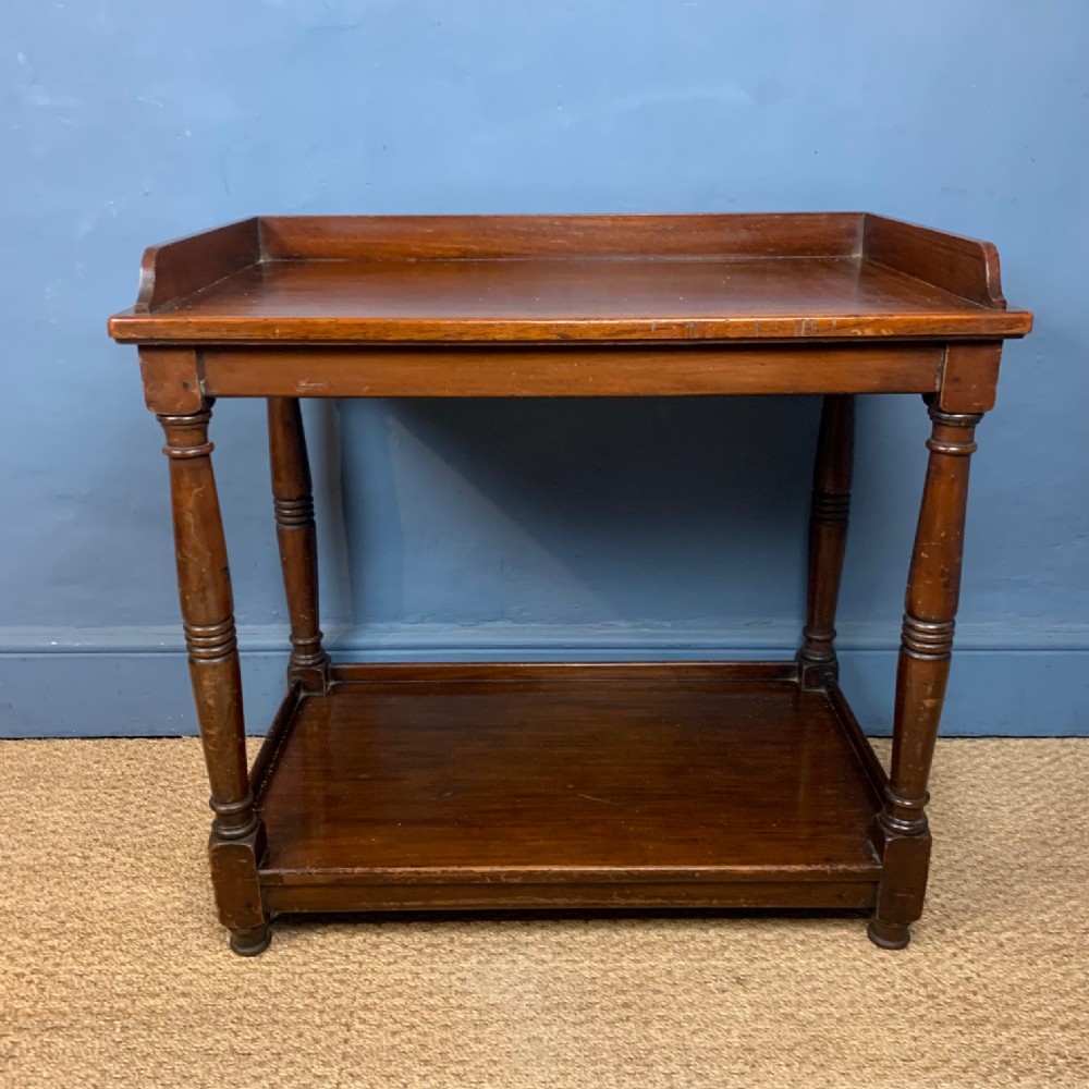 An Aesthetic Movement walnut 2 tier table circa 1880 .
