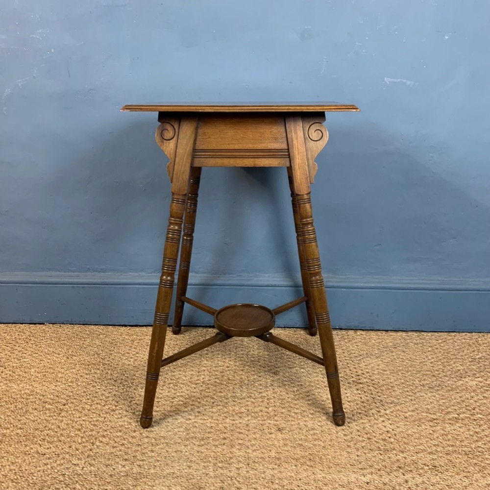 An Aesthetic Movement walnut table circa 1890 