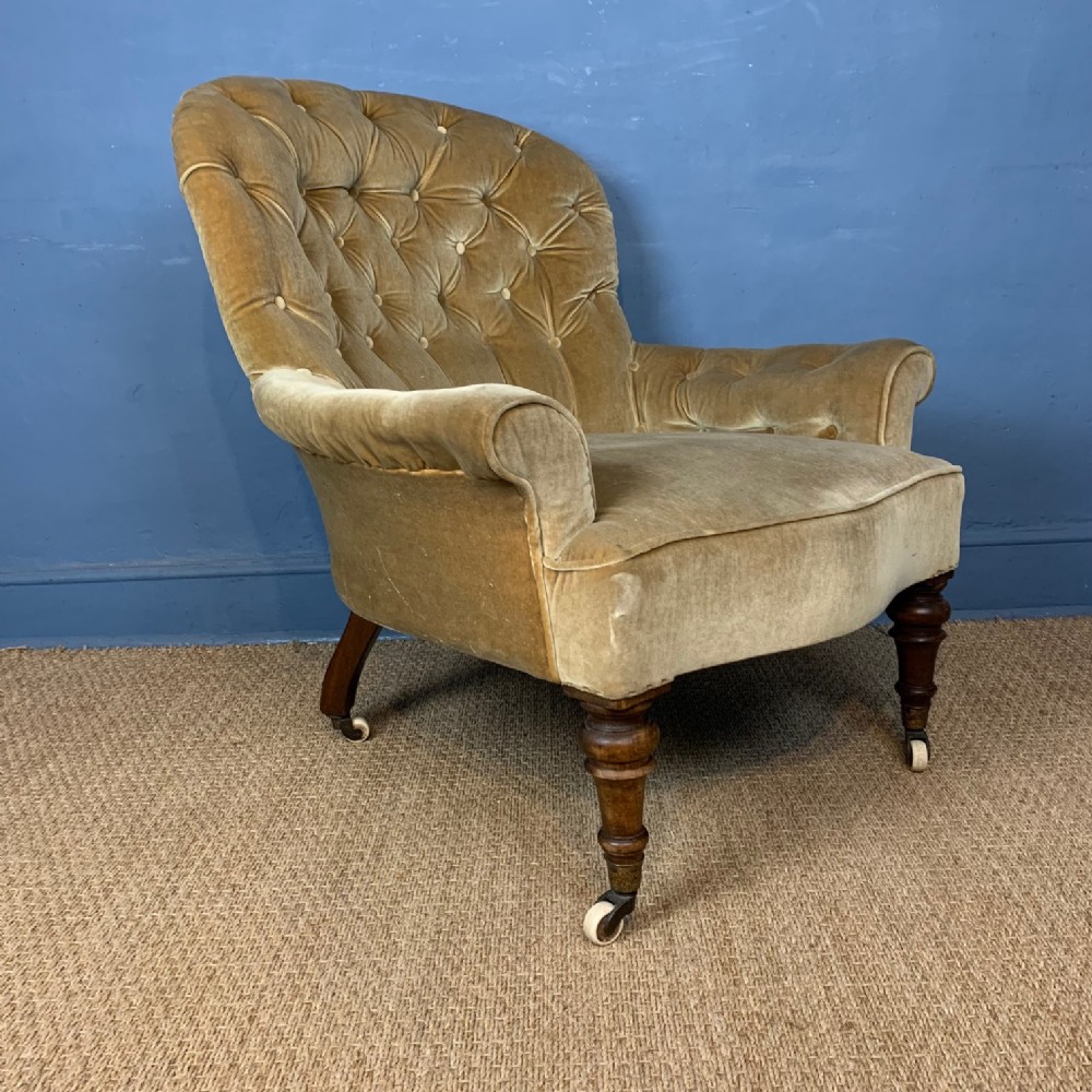 A large Victorian button back armchair circa 1860