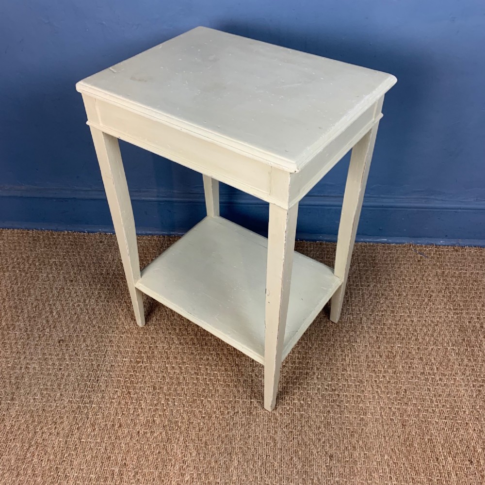 A late Georgian two-tiered rectangular pine table