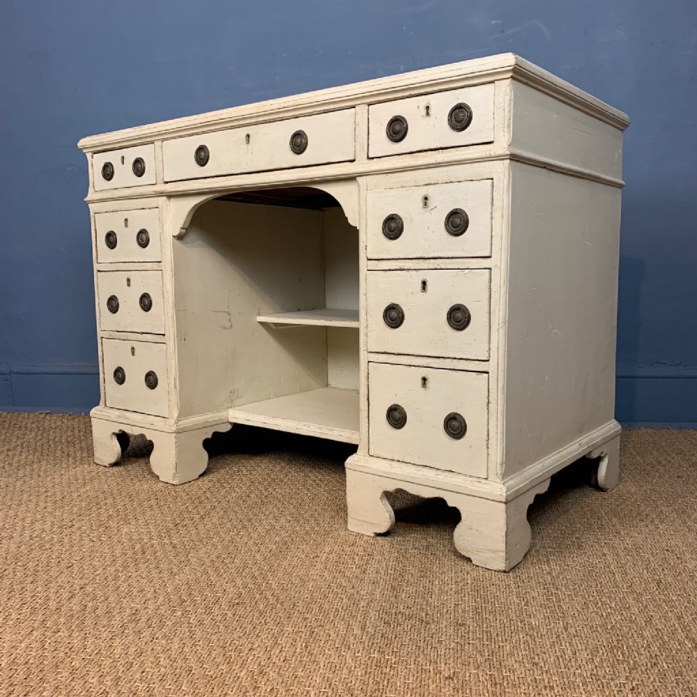 A Georgian painted pine kneehole desk circa 1820