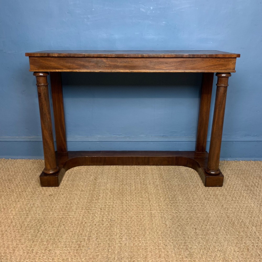A George IV mahogany and leather topped console table circa 1830