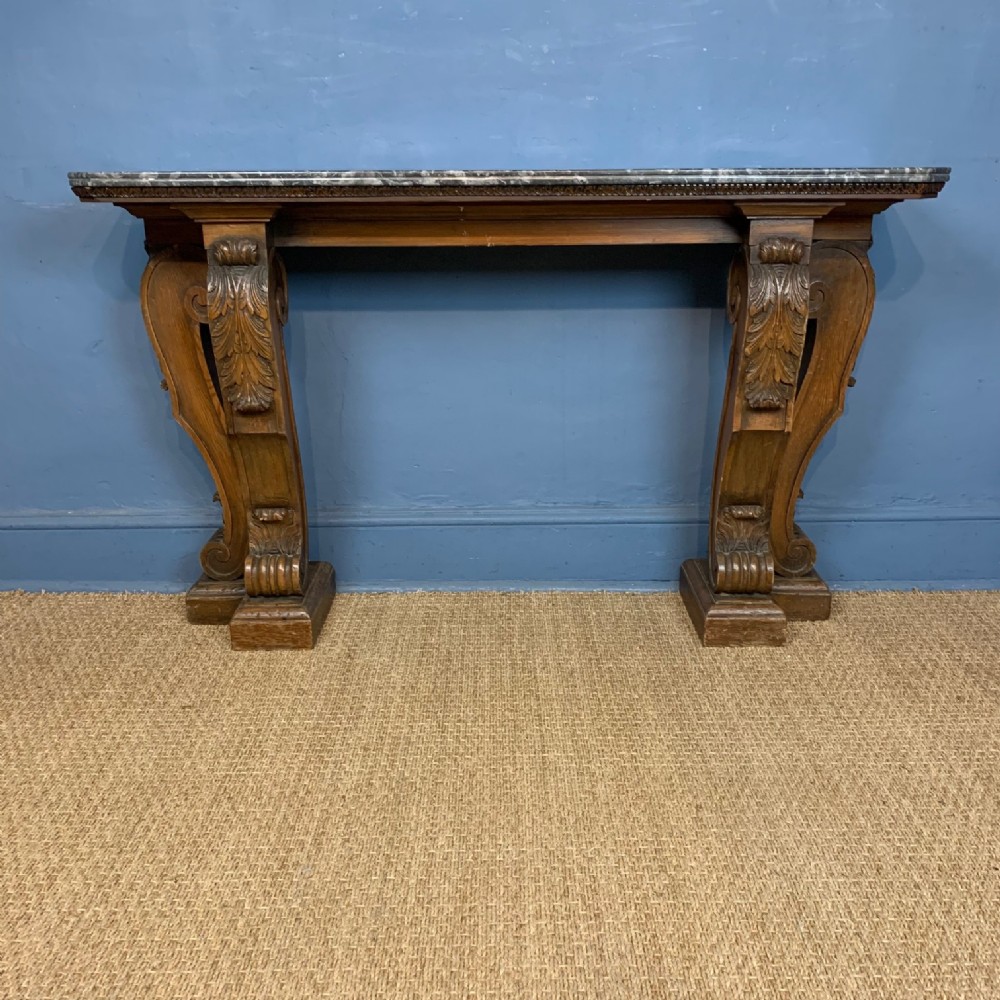 A William IV Scottish Larchwood console table in Kentian style with original shaped grey marble top circa 1835