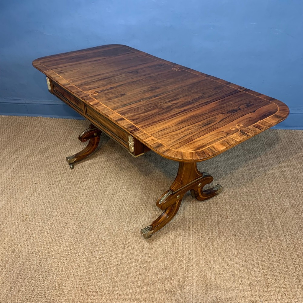 A George IV rosewood and gilt brass mounted sofa table circa 1830